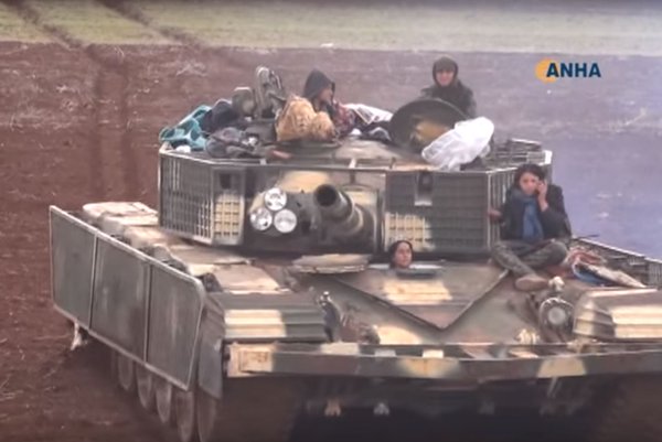 #PT Female Kurdish fighter driving T-72 MBT w/ slate armor, US provided M2 used against rebels, RuAF air support. 