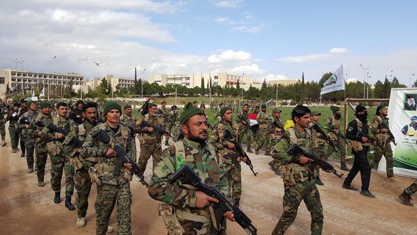 Iraqi Shiite Group Asa'ib Ahl al-Haq League of the Righteous during a parade in Aleppo  