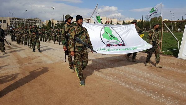 Iraqi Shiite Group Asa'ib Ahl al-Haq League of the Righteous during a parade in Aleppo  