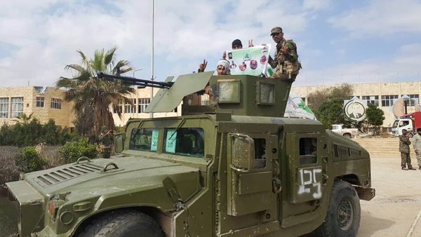 Iraqi Shiite Group Asa'ib Ahl al-Haq League of the Righteous during a parade in Aleppo  