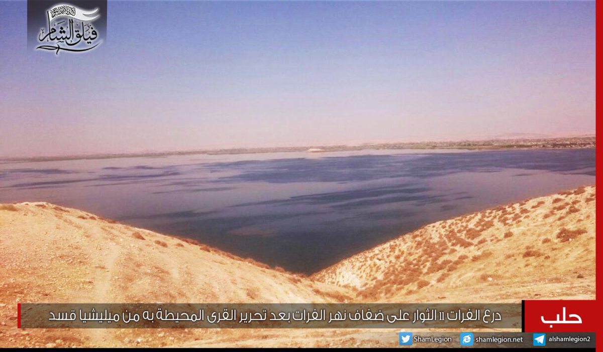 Sham Legion fighters on the shores of the Euphrates river after capturing villages in the area