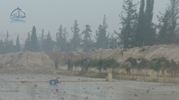 Jaish Al-Mujahideen inside Al-Soura checkpoint in Al-Assad suburb with one prisoner