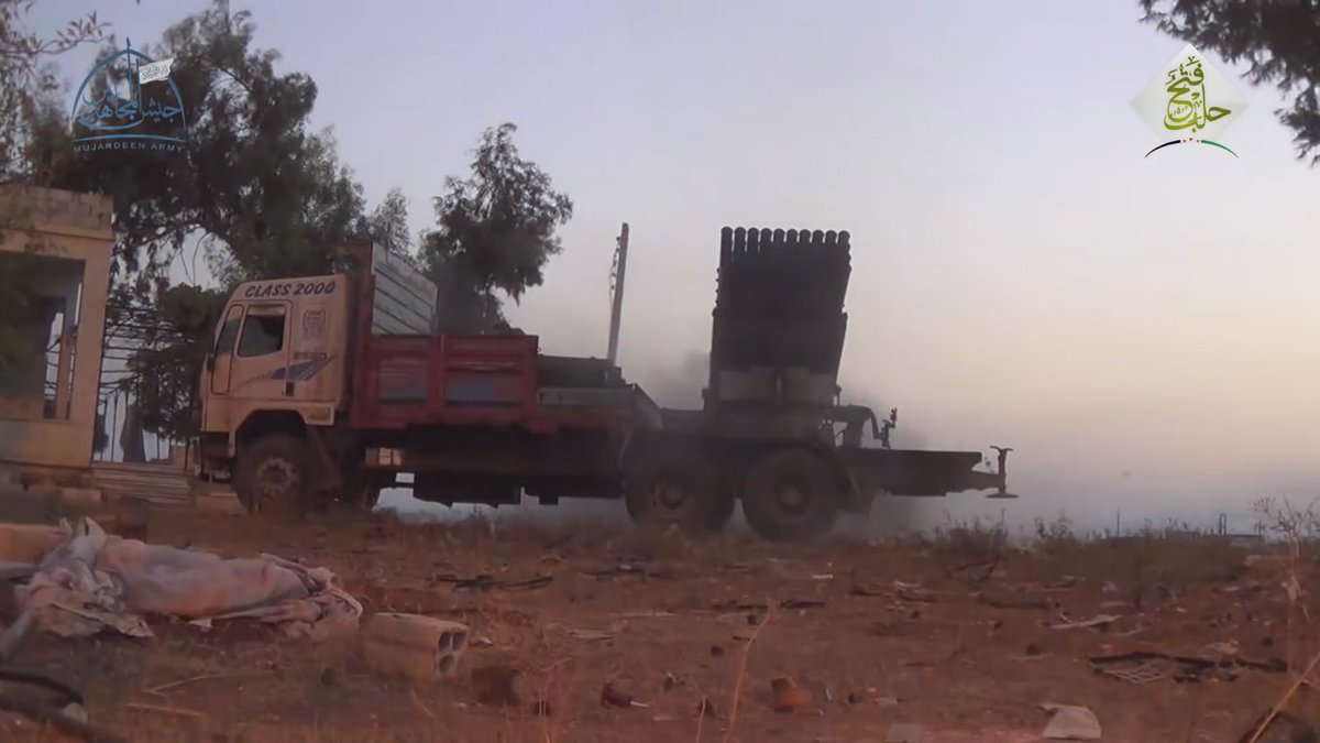 Rebels firing grad rockets in Aleppo at the military academy   