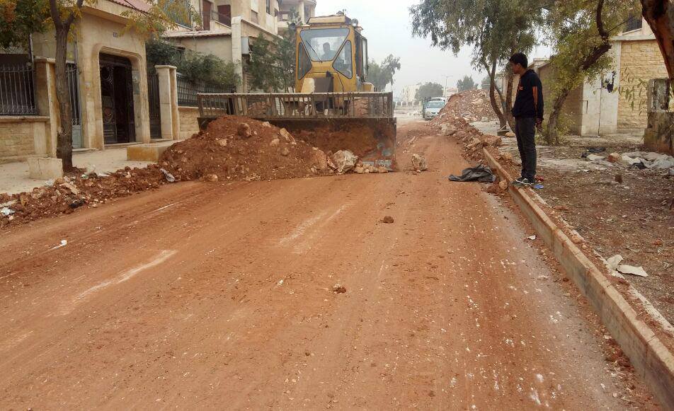 Reconstruction continues:Syrian gov. repairing roads after rebels attacks on Al Hamidaniyah/3000 Project, West Aleppo