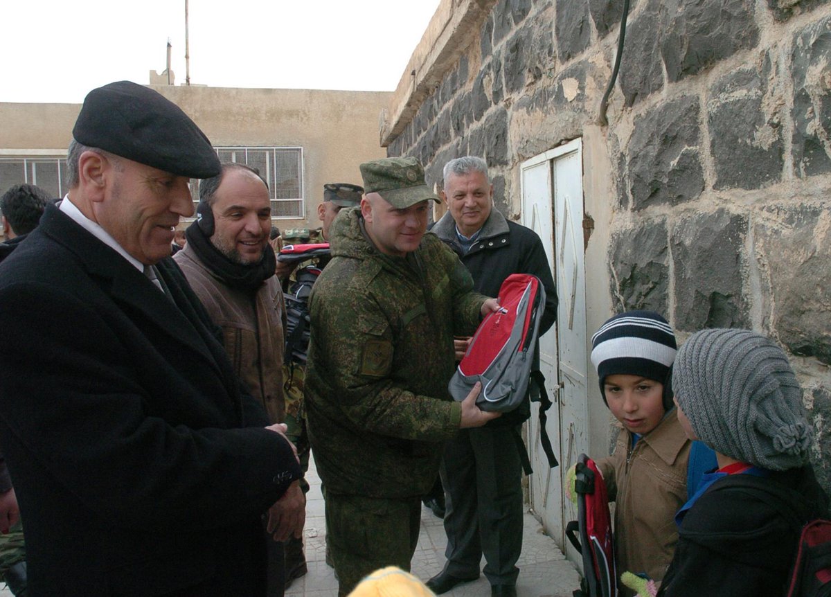 Russian soldiers distributed gifts and backpacks from children in Russia to Syrian children in Umm Dubeib, al-Sweida, Syria. 