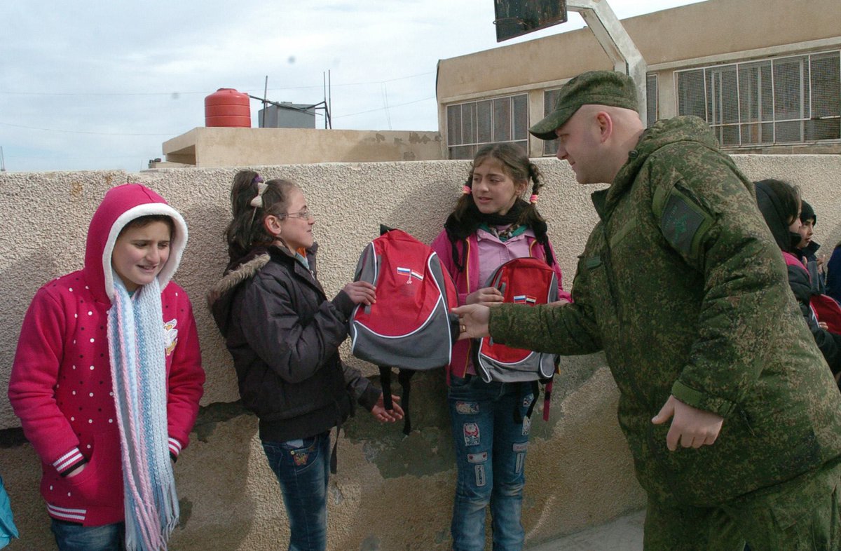 Russian soldiers distributed gifts and backpacks from children in Russia to Syrian children in Umm Dubeib, al-Sweida, Syria. 