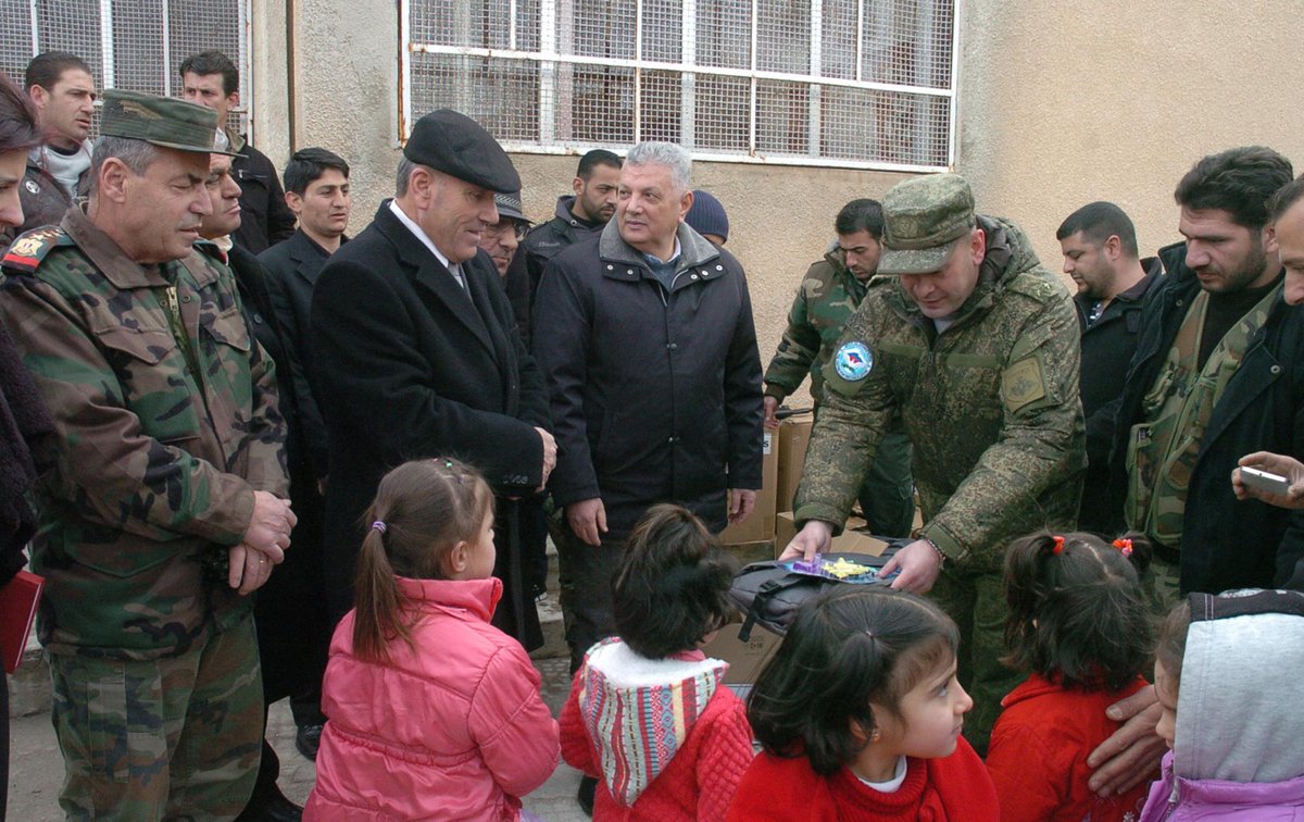 Russian soldiers distributed gifts and backpacks from children in Russia to Syrian children in Umm Dubeib, al-Sweida, Syria. 
