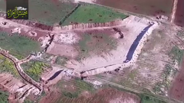 Drone video showing how Jaysh al-Izza took back Tarabia CP near Helfaya. TOW strike filmed  and mass escape.