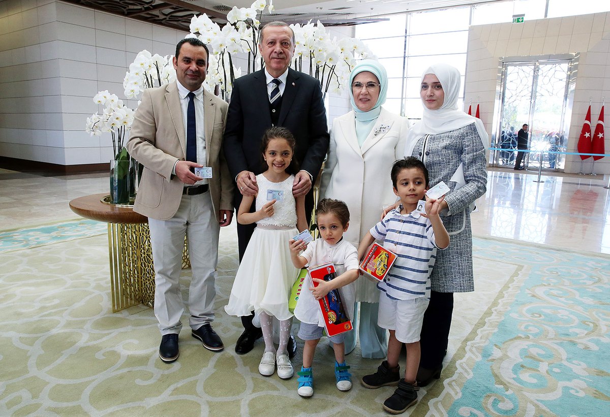 Turkish President Erdoğan hands over Turkish citizen IDs to .@AlabedBana and her family in Ankara, making them new Turkish citizens.
