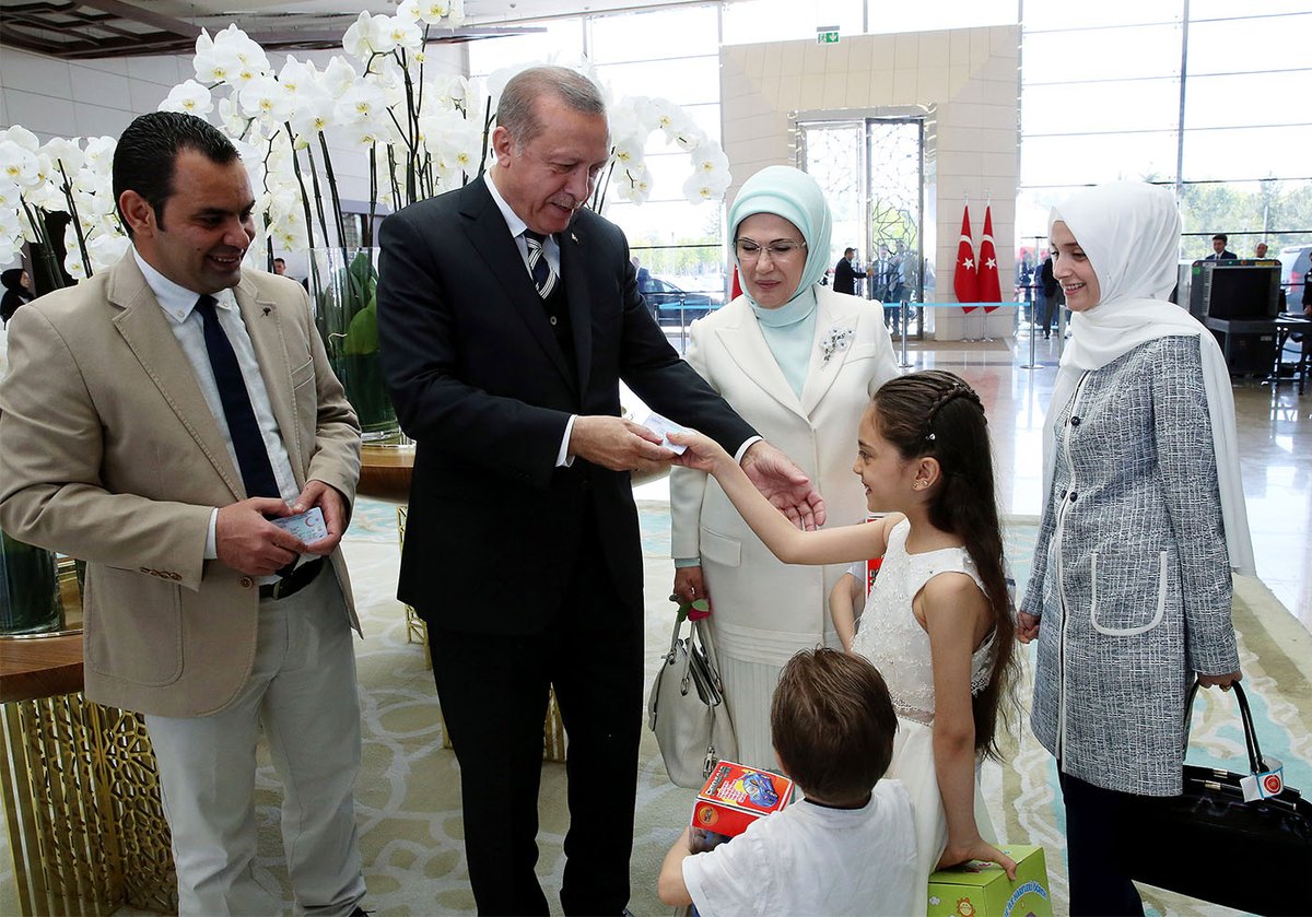 Turkish President Erdoğan hands over Turkish citizen IDs to .@AlabedBana and her family in Ankara, making them new Turkish citizens.