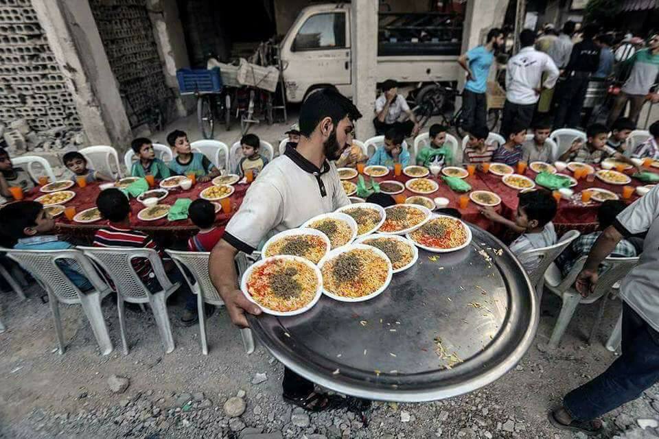Joint iftar evening meal the besieged city of Douma for Syrian orphans  