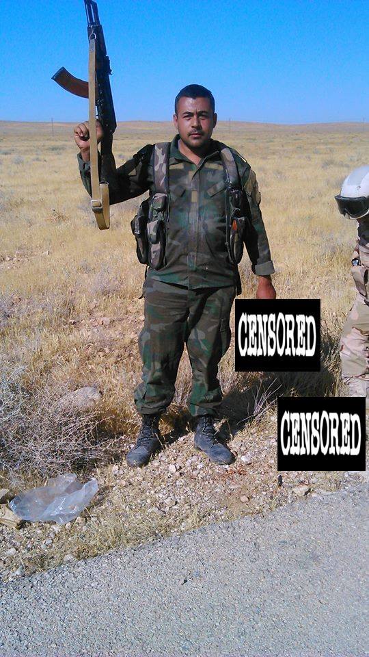 Syrian Army Desert Hawks pose and take photos with the severed heads of IS fighters they killed in eastern Hama, Syria.  