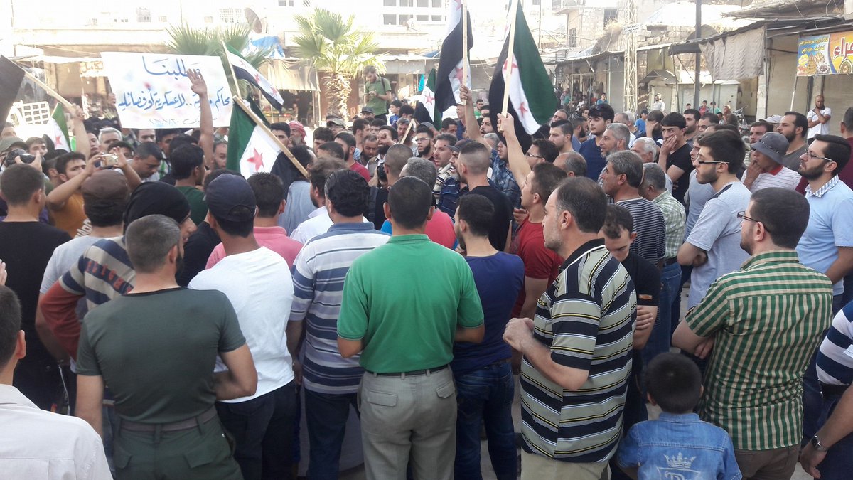 Protesters in Maarat a-Numan, Idlib, take down Jabhat a-Nusra (HTS) flags  and  chant against the group.  