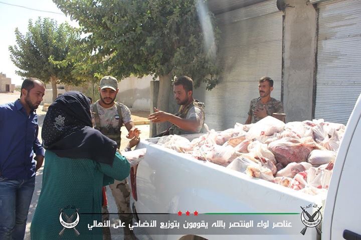 Syrian Turkmen rebels in northern Aleppo distribute aid to civilians during Eid al-Adha feast  