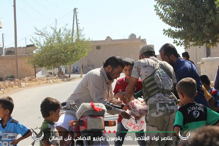 Syrian Turkmen rebels in northern Aleppo distribute aid to civilians during Eid al-Adha feast  