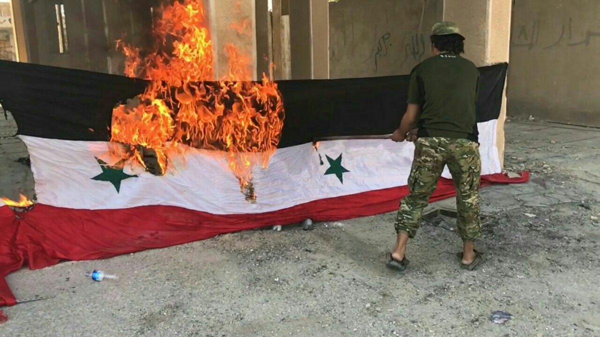 Rebels burn photos of Bashar al-Assad after takeover of points in northern Hama