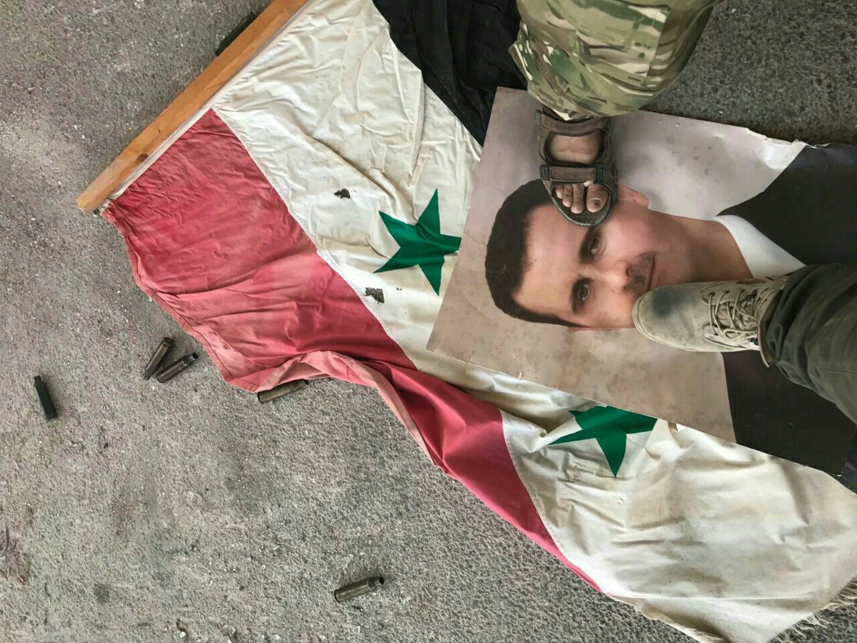 Rebels burn photos of Bashar al-Assad after takeover of points in northern Hama