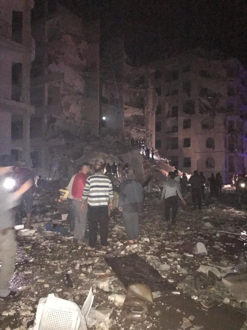 Building collapsed in Idlib city after ballistic missile hit it