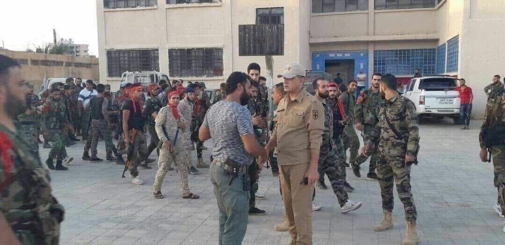 Sectarian Iraqi Shia militias Liwa Abu Al Fadl Al Abbas wearing Syrian Army uniform in Dael west Daraa with a Russian officer   