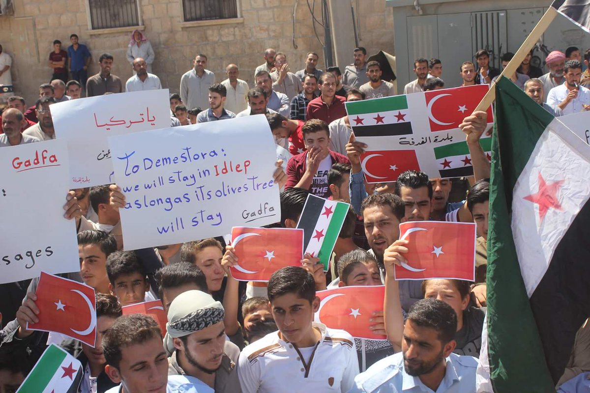 Demonstrators demanding from the Turkish forces to protect civilians