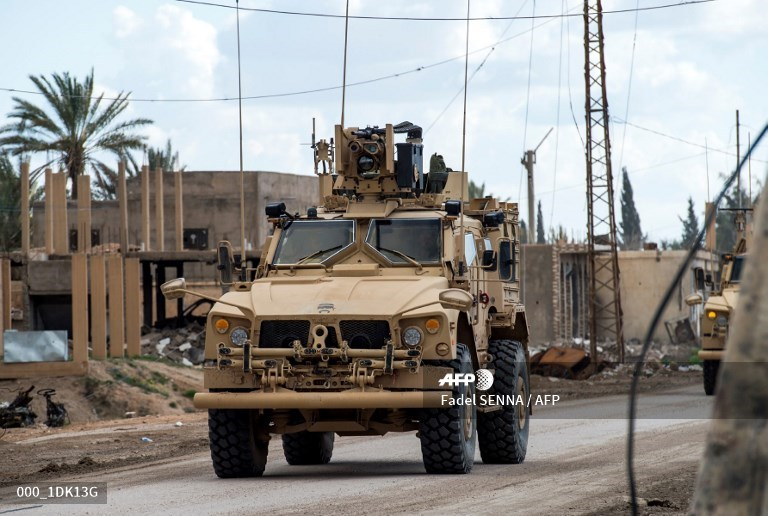 Another column, in Baguz village, of US Forces Cougar 4x4 TOW, Oshkosh and Humvees.  Photo: Fadel SENNA / AFP   