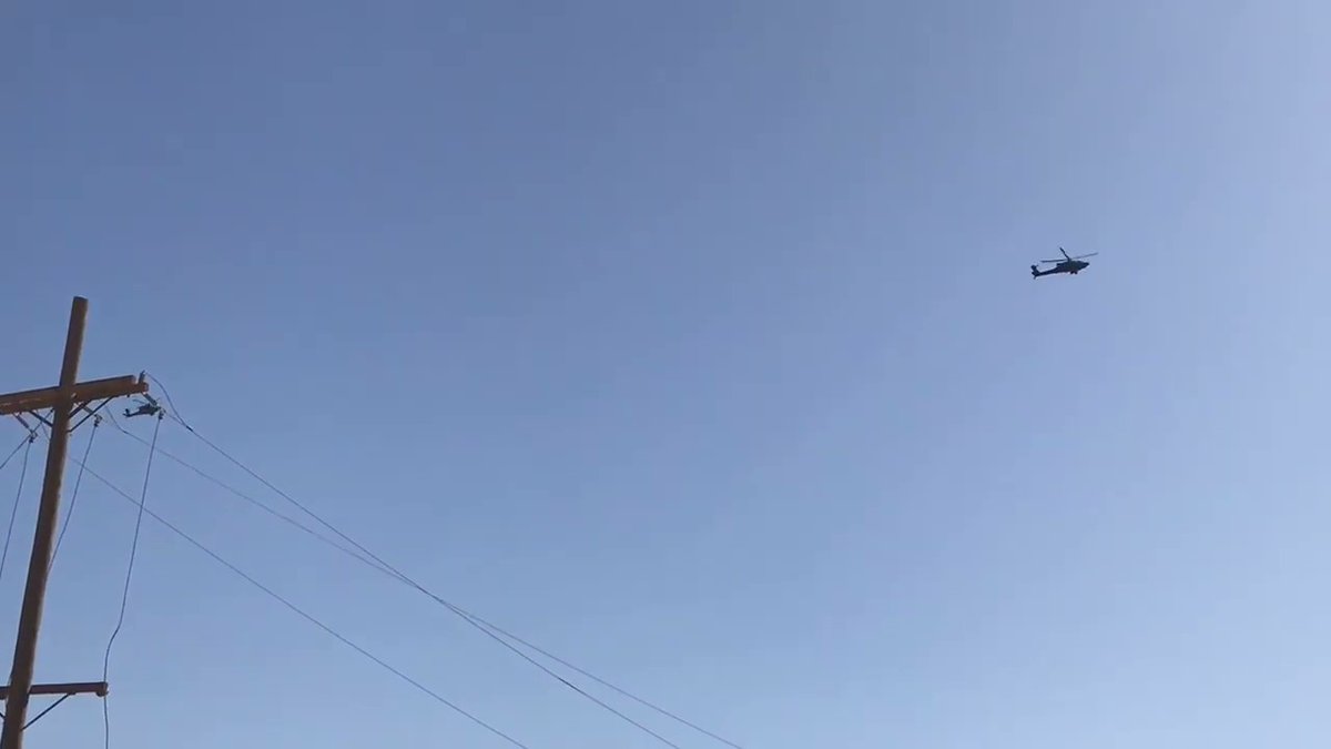 Two Coalition (U.S) attack helicopters soaring the skies over the town of al-Baghouz, looking for ISIS targets.   