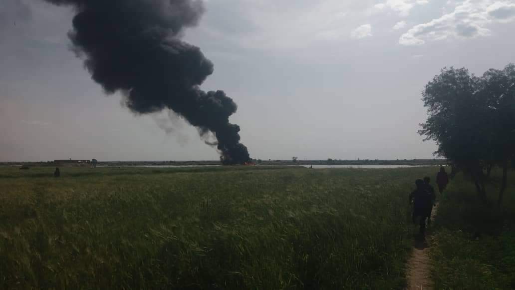 Ferry carrying crude oil caught fire on the shore of the Euphrates River at Buqrus village in eastern Deir ez-Zur