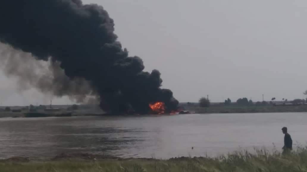 Ferry carrying crude oil caught fire on the shore of the Euphrates River at Buqrus village in eastern Deir ez-Zur