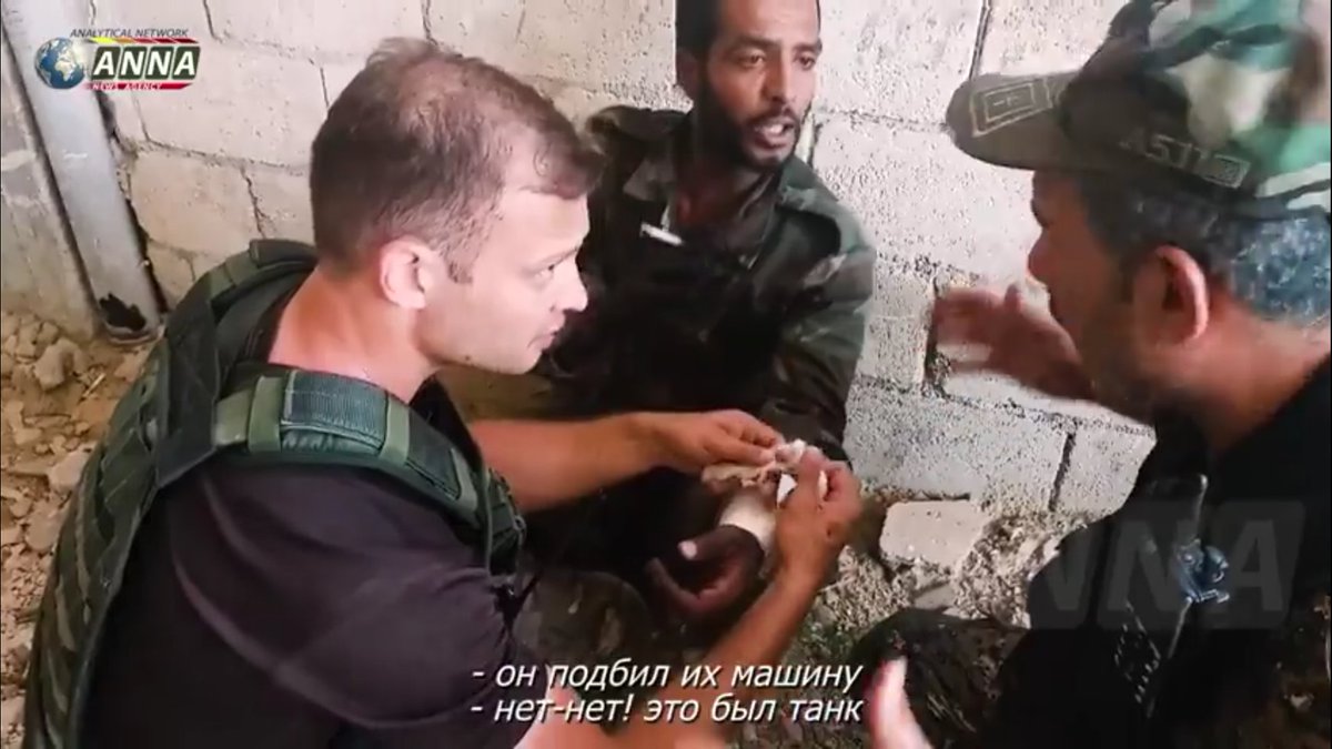 ANNA correspondent in north Hama giving SAA tank man first aid after it was hit with what appears to RPG   