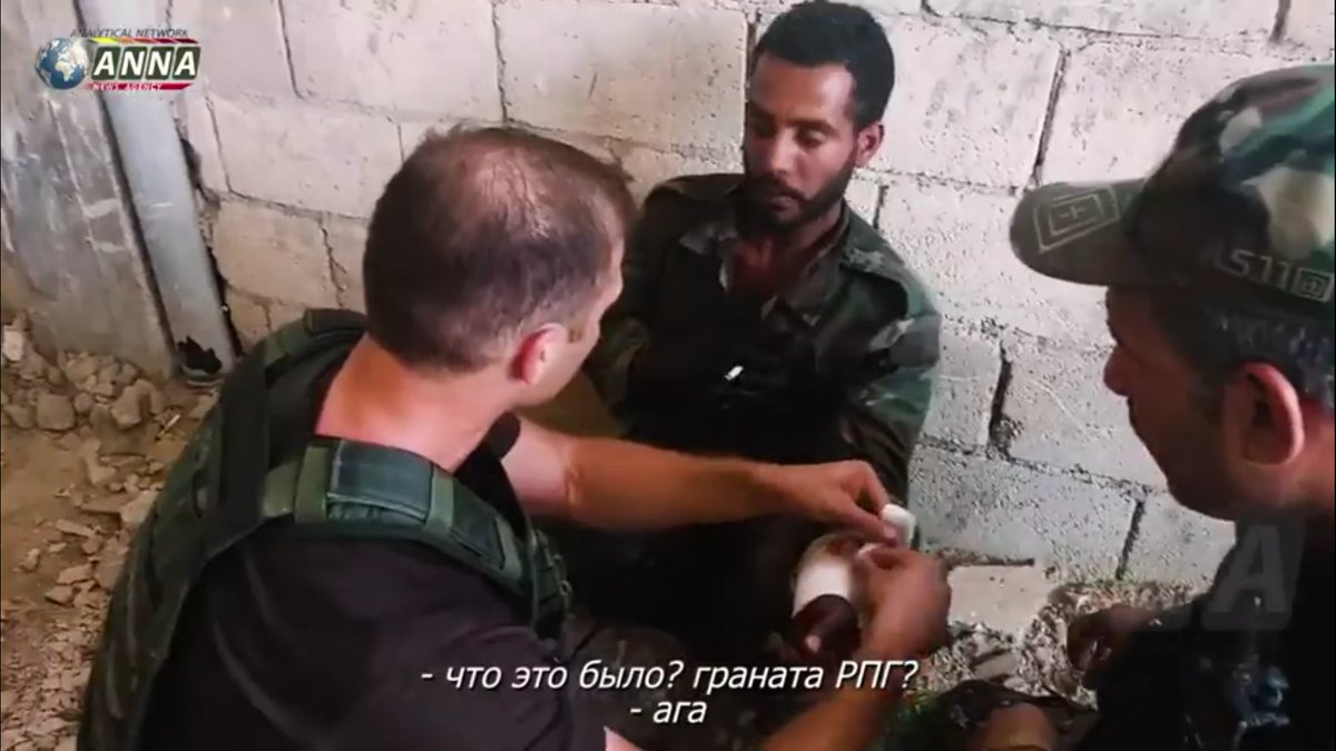 ANNA correspondent in north Hama giving SAA tank man first aid after it was hit with what appears to RPG   