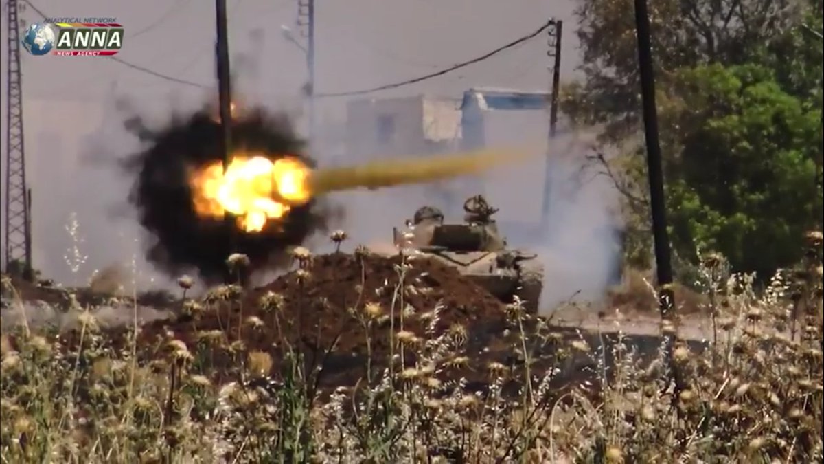 ANNA correspondent in north Hama giving SAA tank man first aid after it was hit with what appears to RPG   