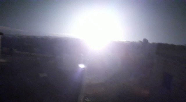 Video of raids by unknown warplanes that set fire to Barisha and Hattan in the northern countryside of Idlib near the Turkish-Syrian border