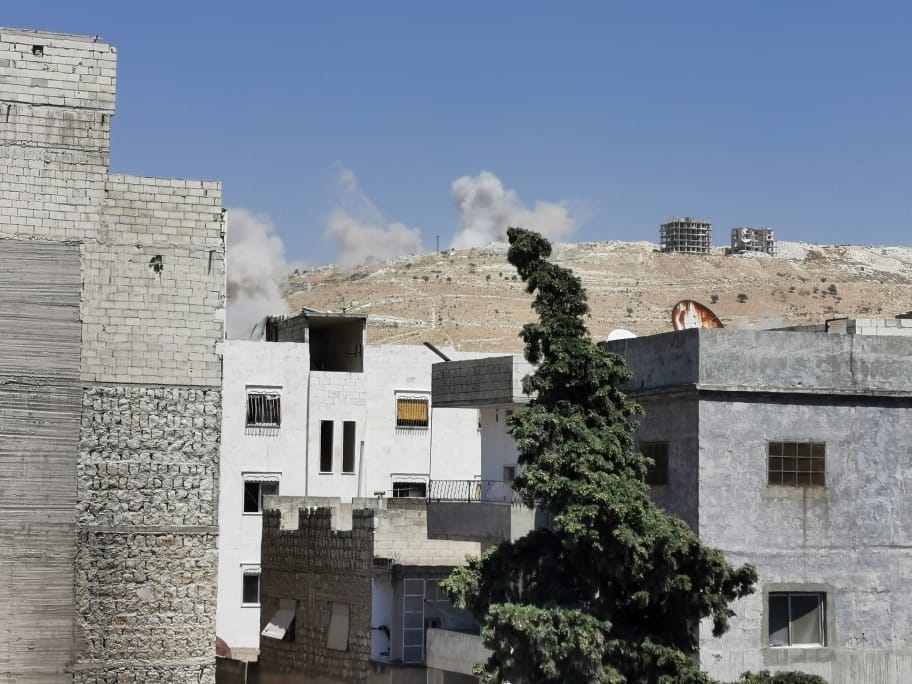 Pro-Assad forces target with rocket launchers, Ariha city in southern Idlib countryside