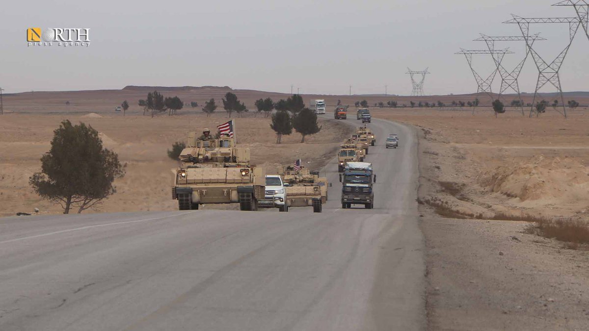 A convoy of the US m2/m3 Bradley fighting vehicle and Humvees are heading to headquarters in Deir_ez_Zor, passing through Hasakah in NE_Syria 