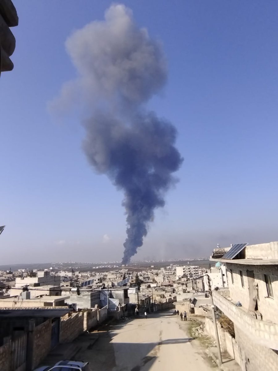 The cloud of smoke resulting from the bombing of the outskirts of the town of Termanin in the northern Idlib countryside