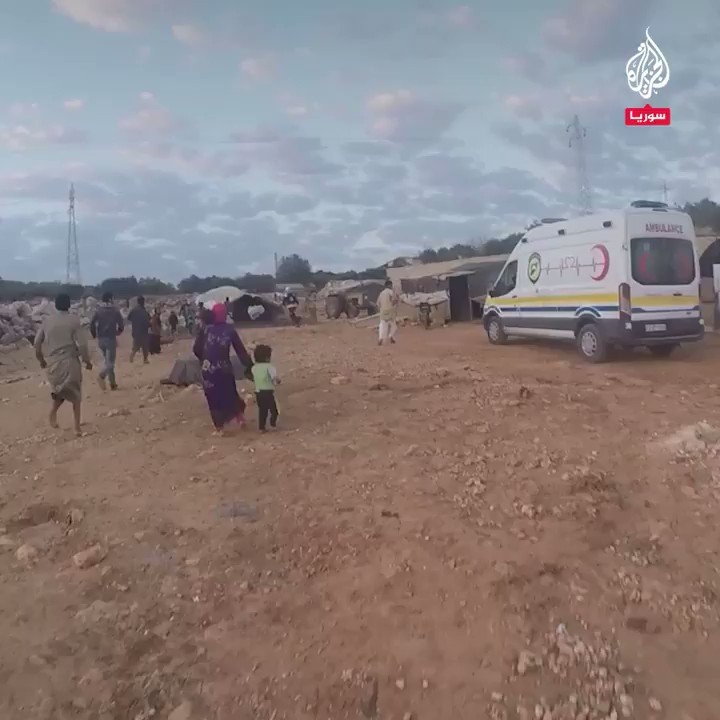 The first moments of the response of the civil defense teams to aiding the wounded and transporting the victims, as a result of the bombing of the government forces and Russia by missiles loaded with cluster ammunition, targeting camps in the vicinity of Kafr Jalis area, west of Idlib