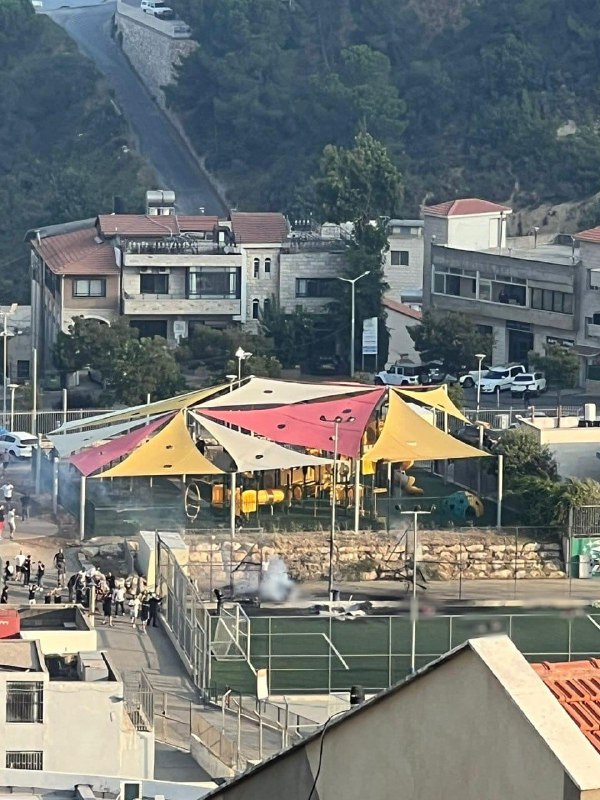 Initial image from the scene of the rocket impact at a soccer field in Majdal Shams that wounded many civilians, including 11 in serious and critical condition.