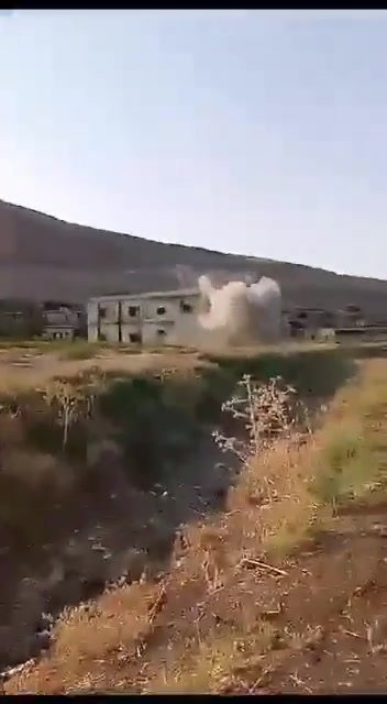 The moment a resident's car was targeted with an FPV drone by Assad forces in the village of Al-Zaqqum in Al-Ghab Plain