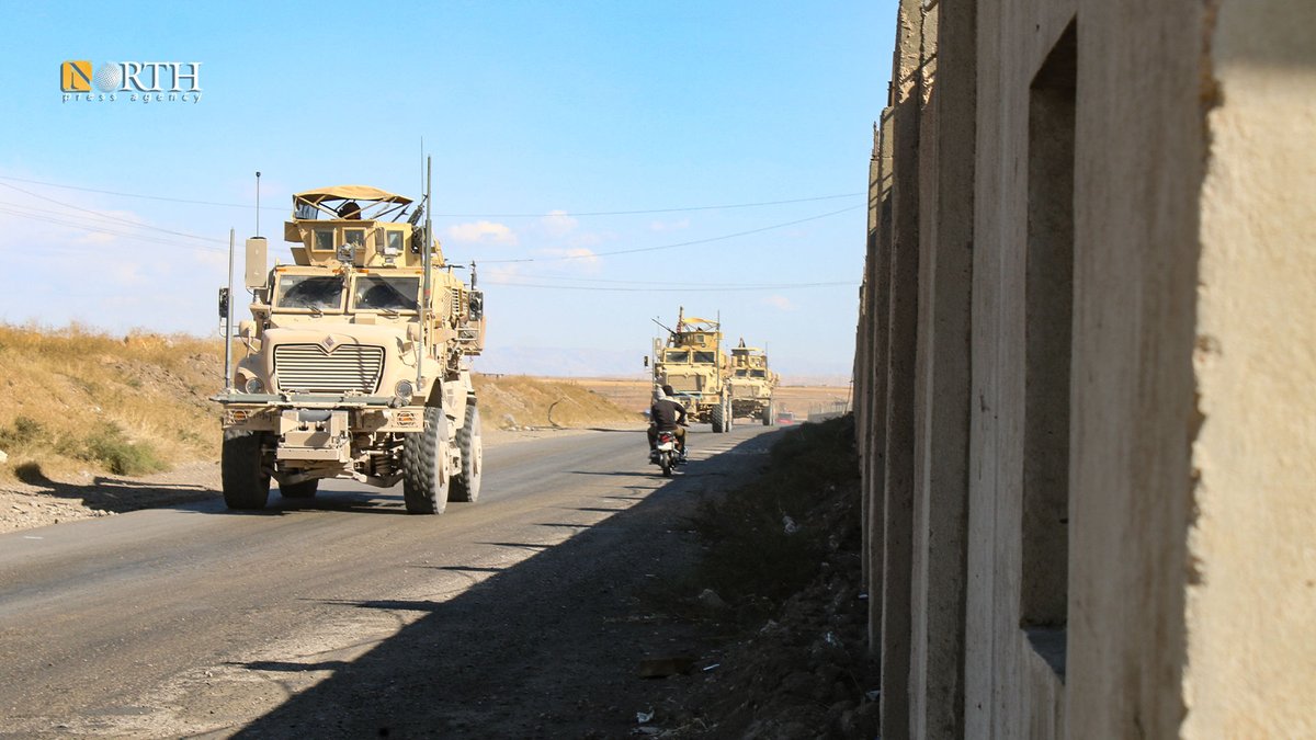 A US patrol roams near the Sweidiya gas plant and oil stations in the countryside of Derik in far NE_Syria after being hit by Turkish airstrikes