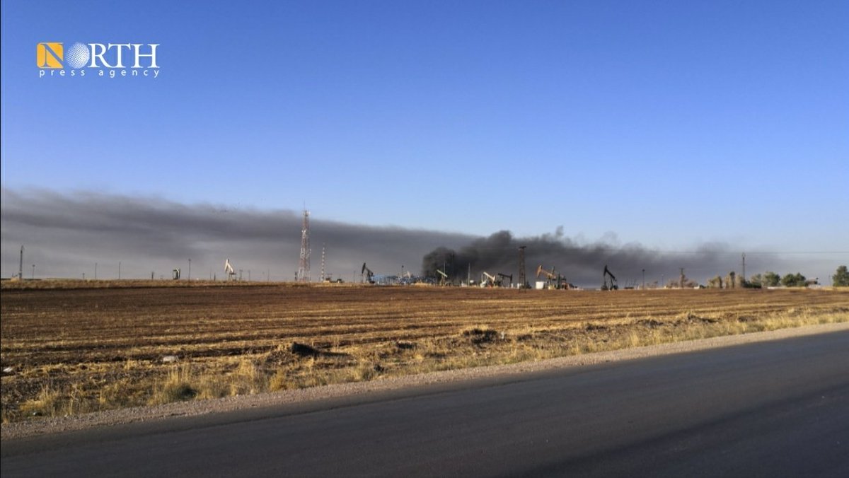 Columns of smoke rise from oil facilities near the town of Tirbe Spiyeh (al-Qahtaniya) in the eastern countryside of Qamishli in NE_Syria due to Turkish airstrikes