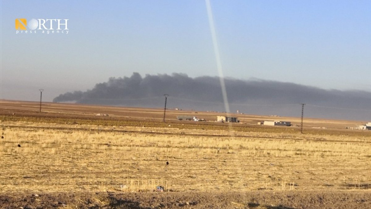 Columns of smoke rise from oil facilities near the town of Tirbe Spiyeh (al-Qahtaniya) in the eastern countryside of Qamishli in NE_Syria due to Turkish airstrikes