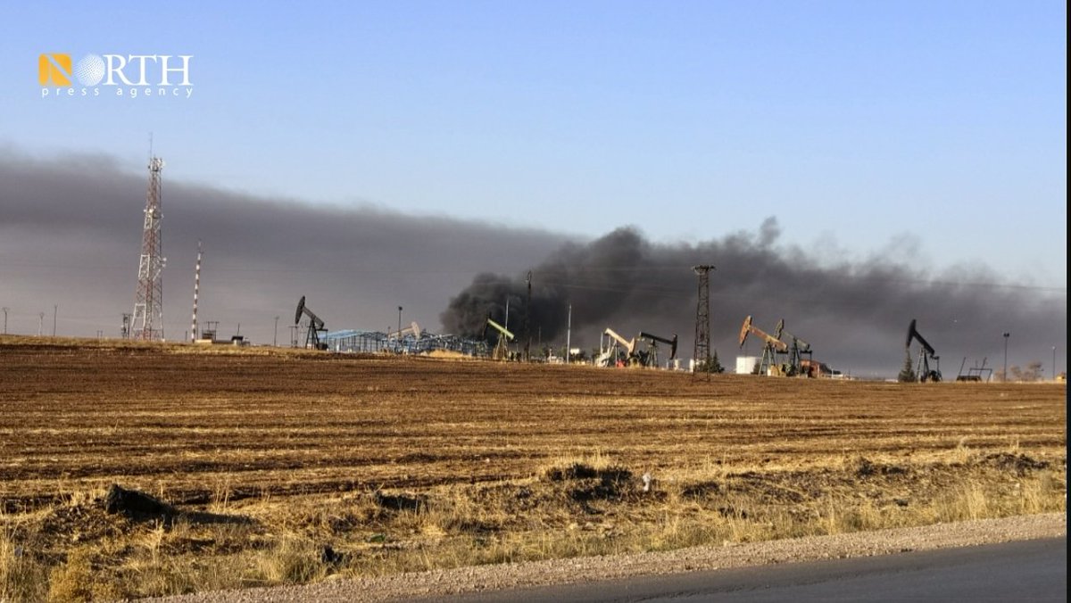 Columns of smoke rise from oil facilities near the town of Tirbe Spiyeh (al-Qahtaniya) in the eastern countryside of Qamishli in NE_Syria due to Turkish airstrikes