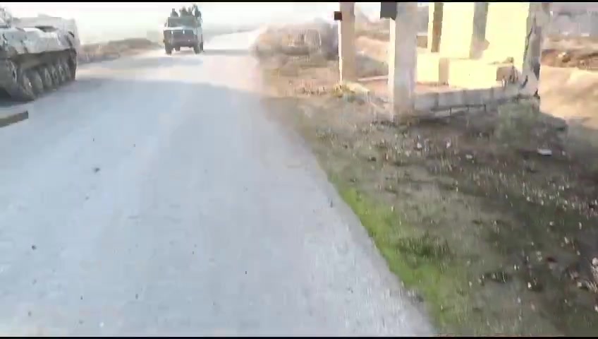 Rebels inside the town of Al-Amqiyah in Saha al-Ghab