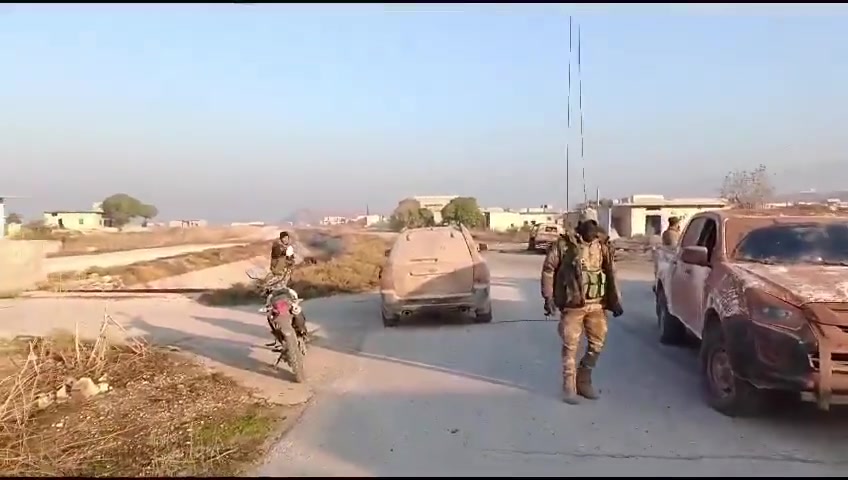 Rebels inside the town of Al-Amqiyah in Saha al-Ghab