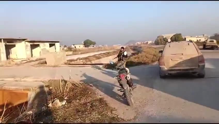 Rebels inside the town of Al-Amqiyah in Saha al-Ghab