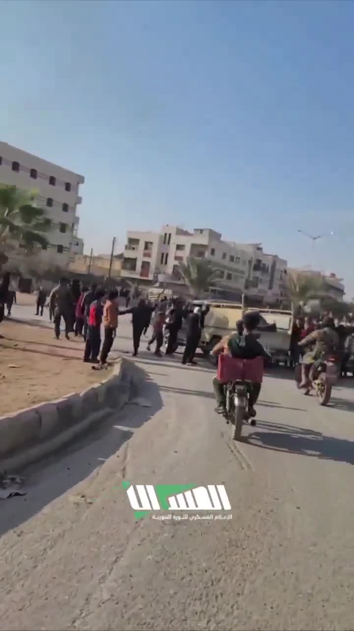 The streets of Hama following the rebel-takeover. Residents gather at intersections to greet rebel forces as they enter they city