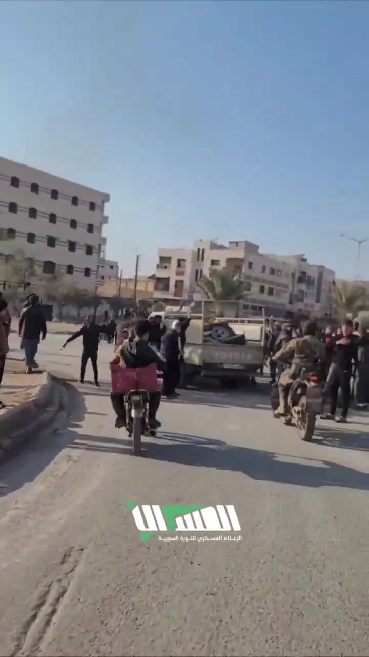 The streets of Hama following the rebel-takeover. Residents gather at intersections to greet rebel forces as they enter they city