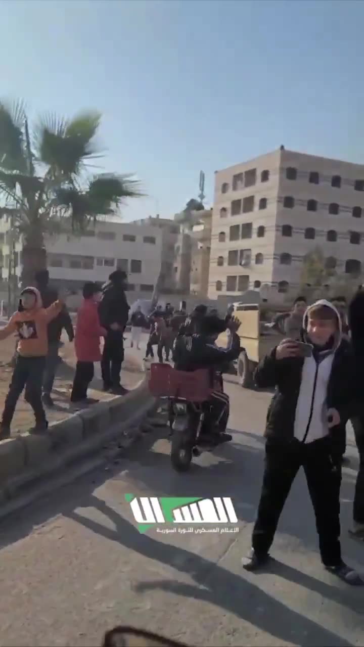 The streets of Hama following the rebel-takeover. Residents gather at intersections to greet rebel forces as they enter they city