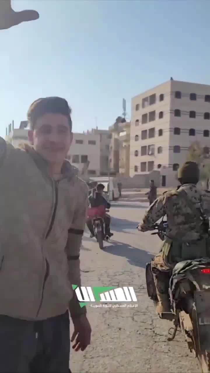 The streets of Hama following the rebel-takeover. Residents gather at intersections to greet rebel forces as they enter they city