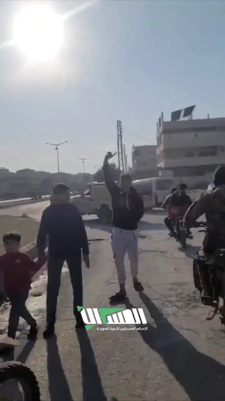 The streets of Hama following the rebel-takeover. Residents gather at intersections to greet rebel forces as they enter they city